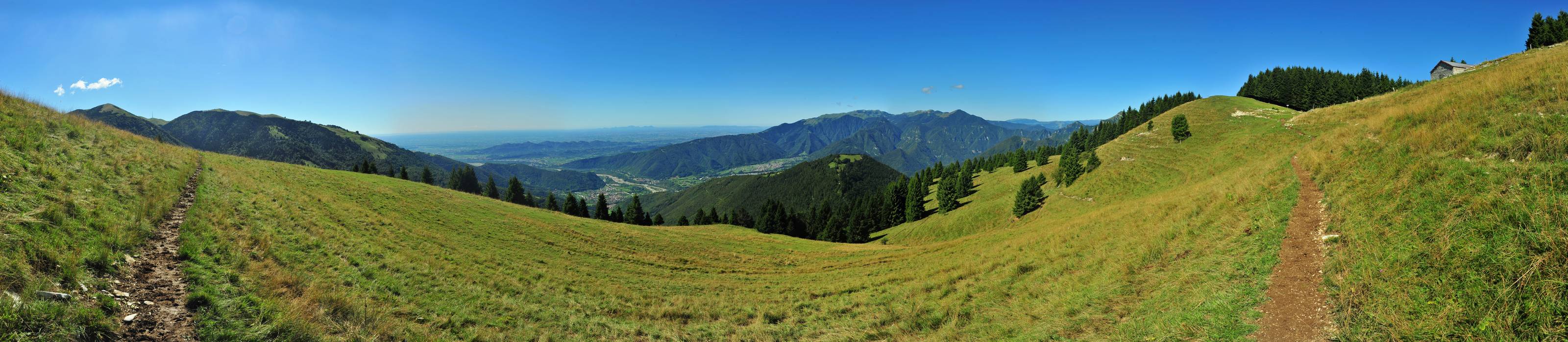 da malga Doc verso monte Cesen, Segusino, pianura e monte Grappa